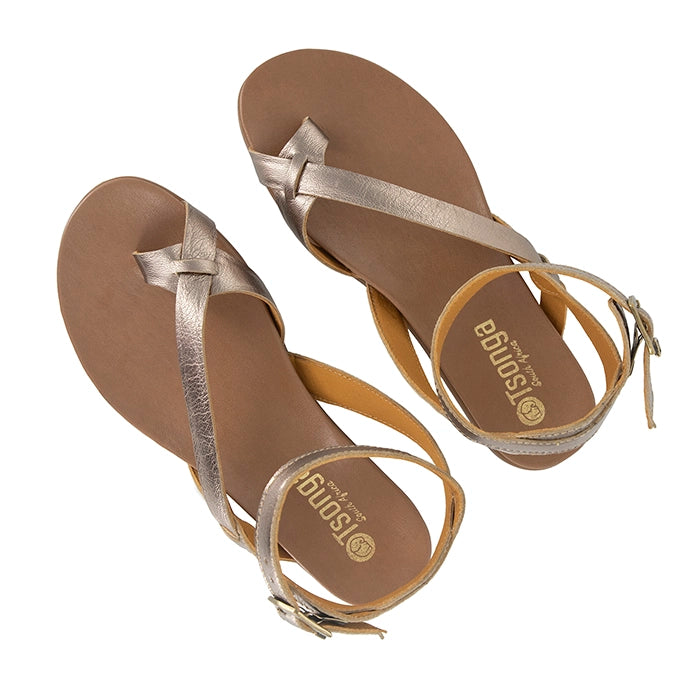 Pair of gold sandals with 'Tsonga' branding on a white background