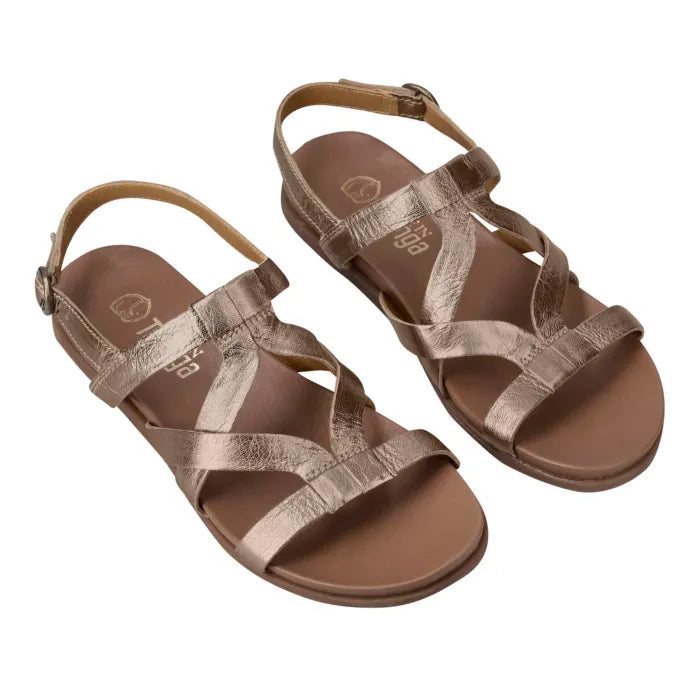 A pair of women's flat sandals with metallic champagne-gold crisscross straps and a brown footbed, shown from a side profile on a white background.
