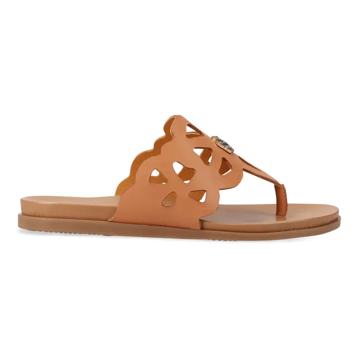 A single tan leather slide sandal with a cutout strap featuring a small rhinestone embellishment, shown on a plain white background.