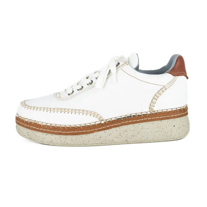 White sneaker with brown accents on a white background