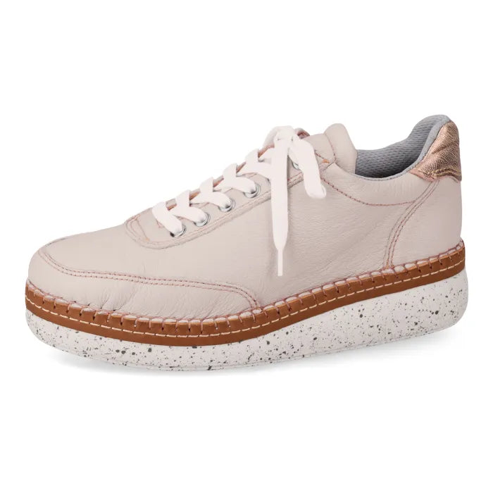 Beige sneaker with brown sole on a white background