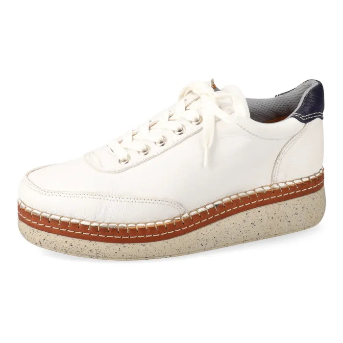 White sneaker with wedge sole on a white background