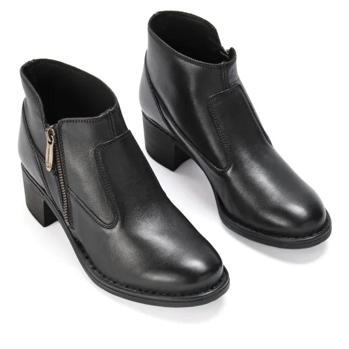 Pair of black leather ankle boots on a white background