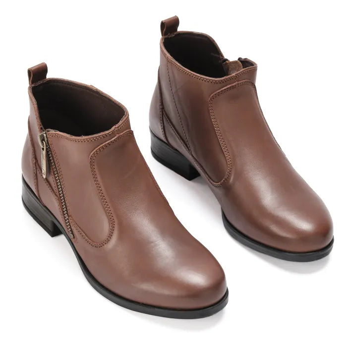 Pair of brown leather ankle boots on a white background