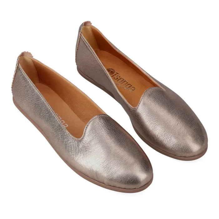 Pair of metallic gold loafers on a white background