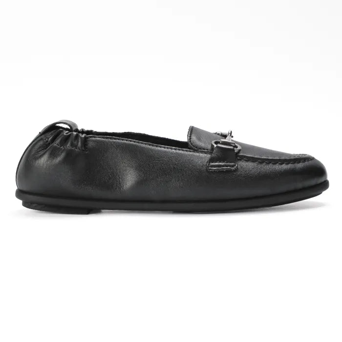 Black slip-on shoe on a white background