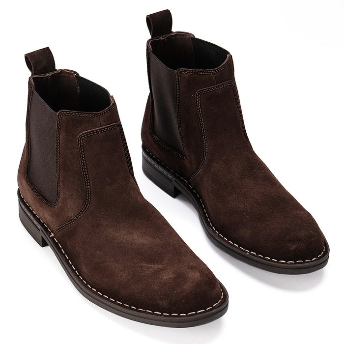 Pair of brown suede boots on a white background