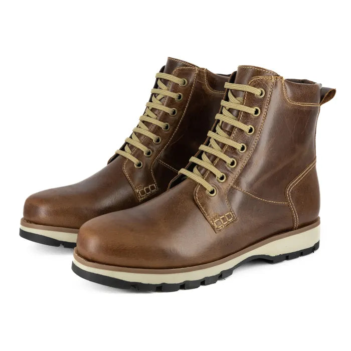 Pair of brown leather boots with beige laces on a white background