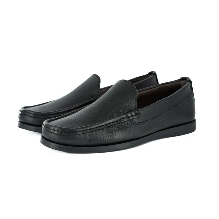 Pair of black loafers on a white background