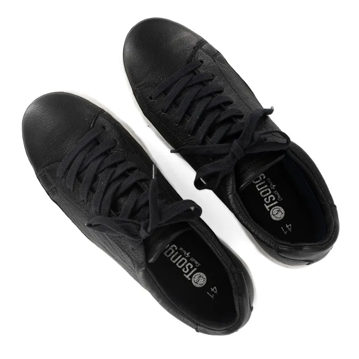 Pair of black sneakers on a white background