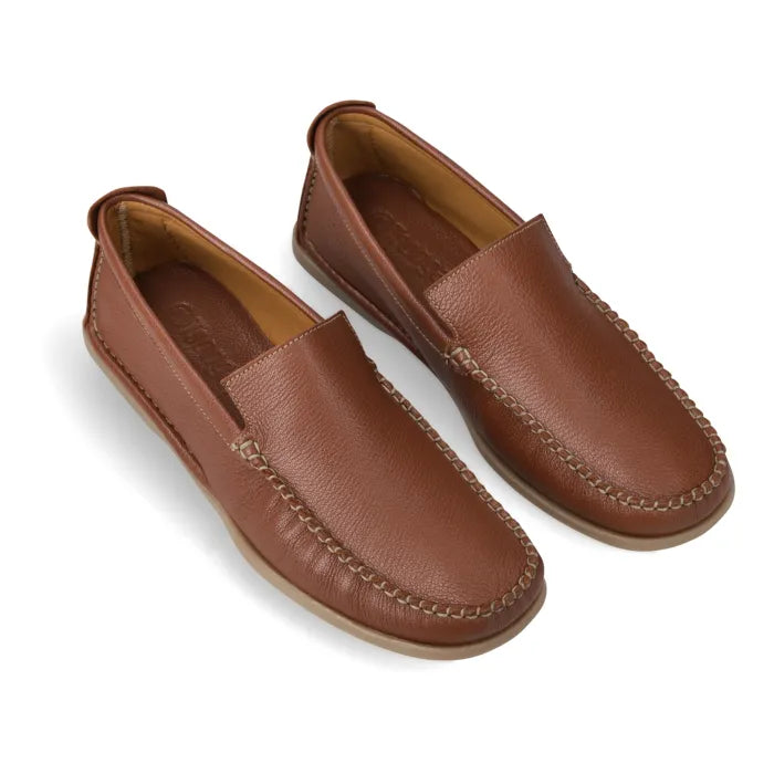 A pair of brown leather moccasin-style slip-on shoes with decorative stitching, shown on a clean white background.
