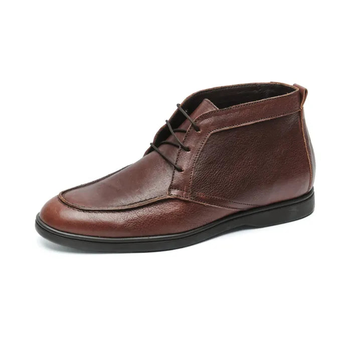 Brown leather chukka boot on a white background