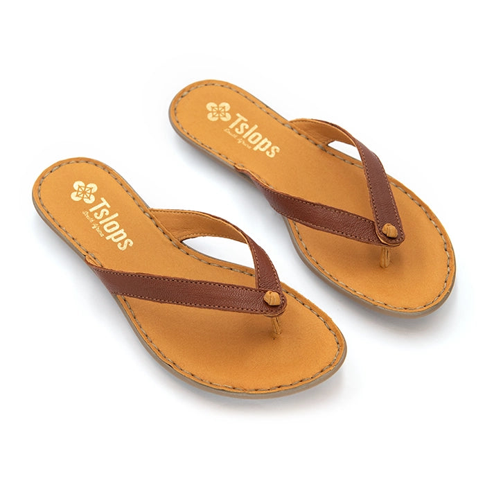 A pair of Tslaps brand flat thong sandals with tan footbeds and dark brown straps, displayed on a clean white background.