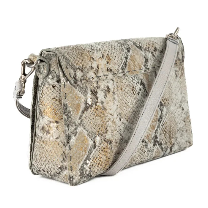 Snake print handbag with a light grey strap on a white background