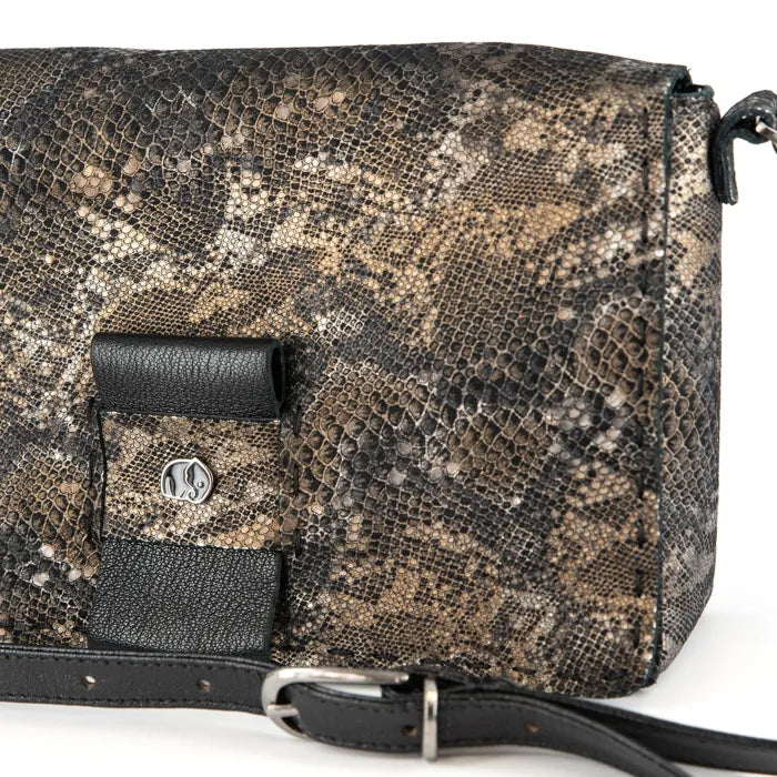 Snake skin patterned handbag with black accents on a white background