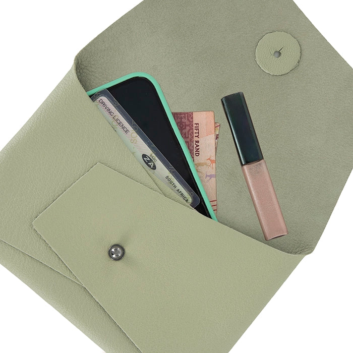 Sage Green leather wallet with phone, card, and lip gloss on a white background