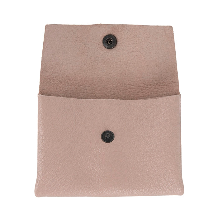 Pink leather pouch with button details on a white background