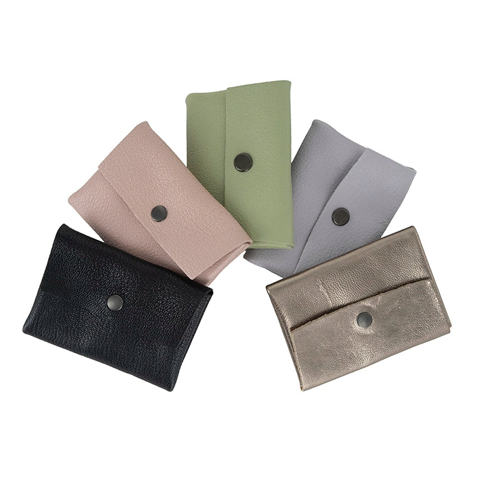 Five small leather pouches in different colors on a white background