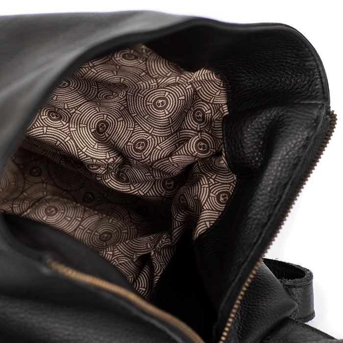 Black leather bag with a patterned lining on a white background