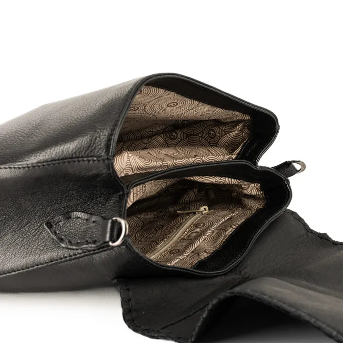 Black leather bag with patterned interior on a white background