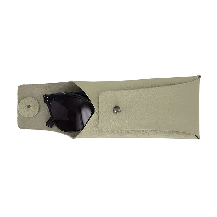 Black sunglasses partially tucked inside an open sage green leather case with a button closure, showcasing the secure and stylish storage design.