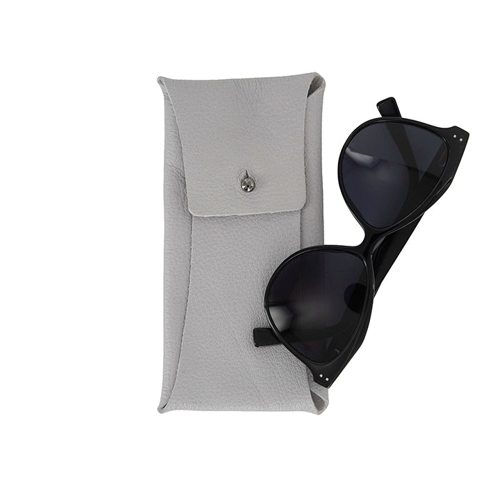 Black sunglasses placed next to a grey textured leather case featuring a button closure.