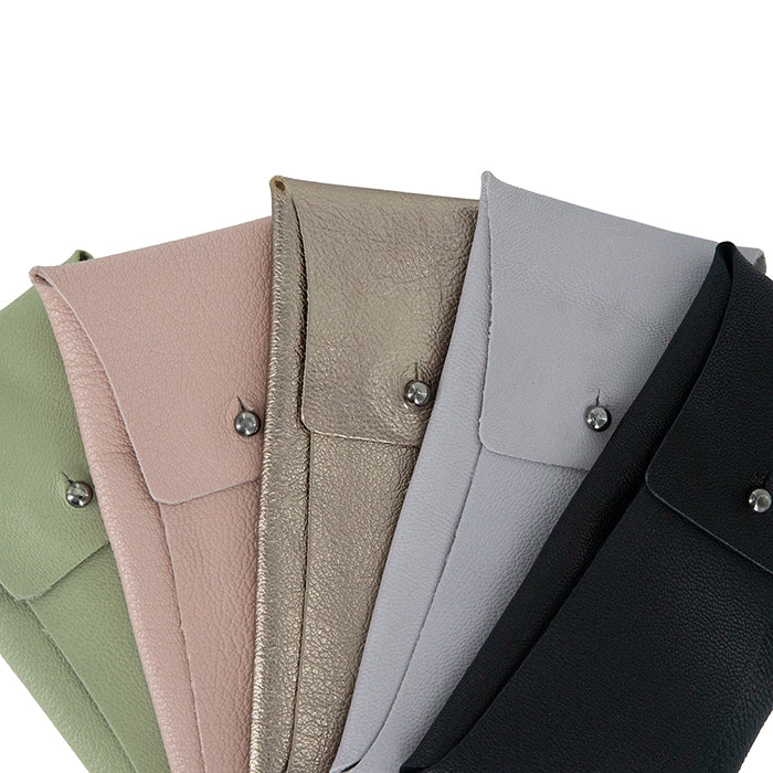 Collection of leather sunglass pouches in various colours on a white background