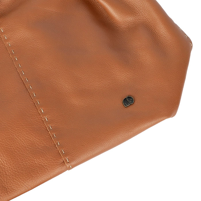 Close-up of a tan leather bag with visible stitching on a white background
