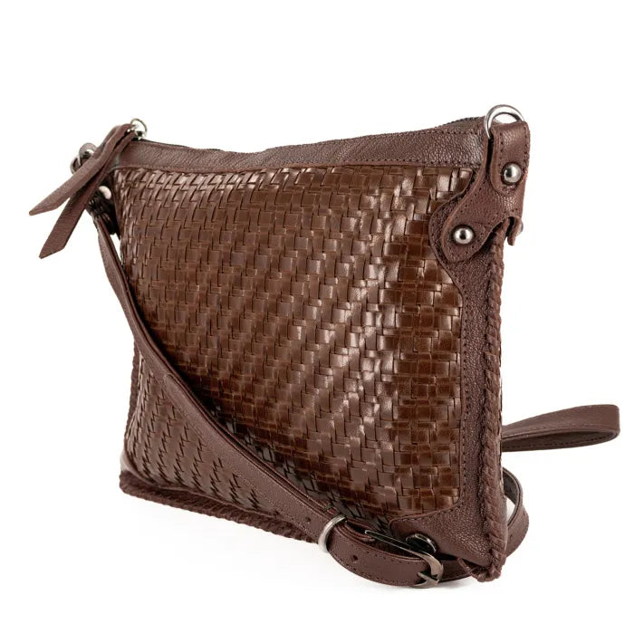 Brown woven leather handbag on a white background