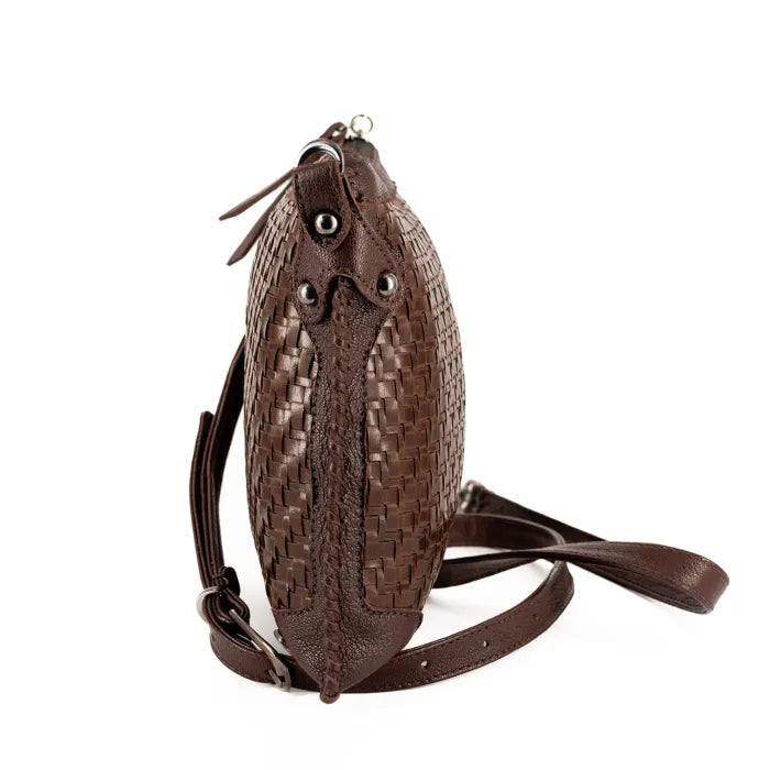 Brown woven leather bag with a strap on a white background