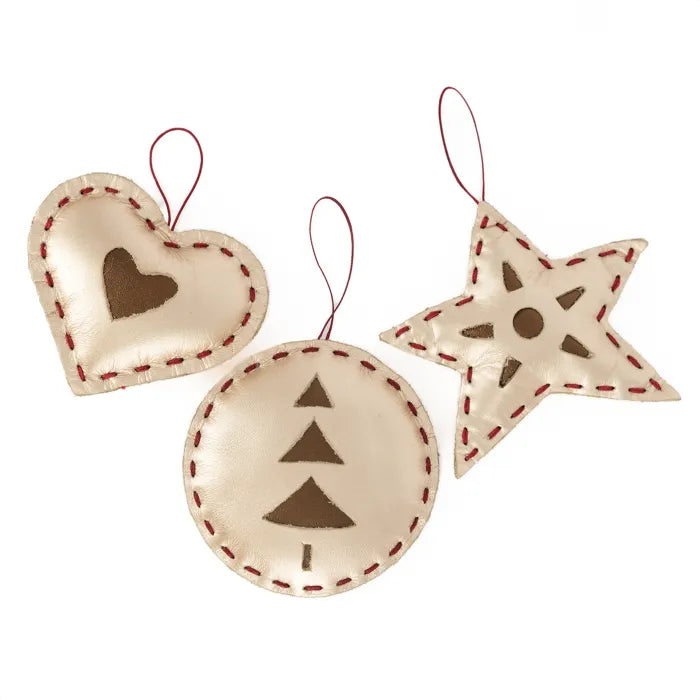 Three decorative Christmas ornaments shaped like a heart, circle, and star on a white background.