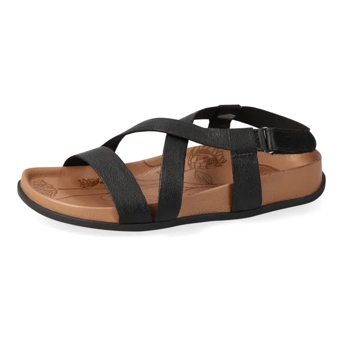 Black sandal with tan sole on a white background