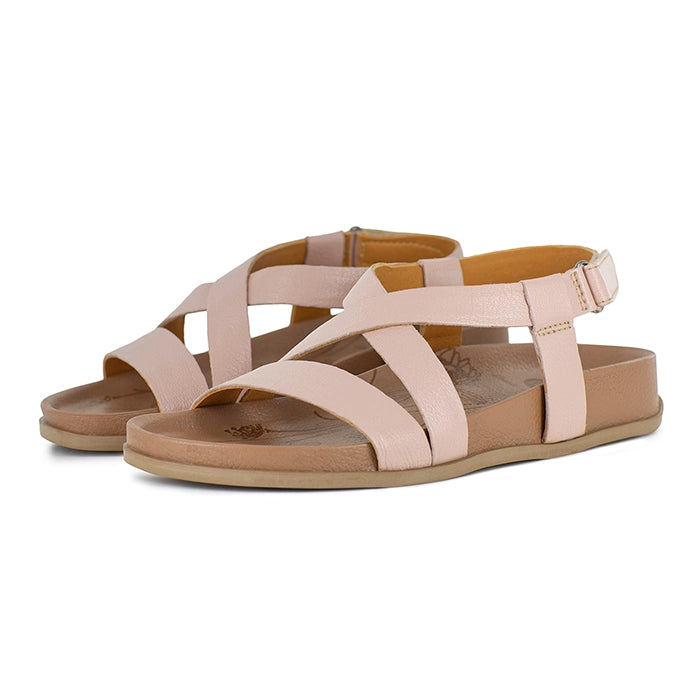Pair of pink  sandals with criss-cross straps on a white background