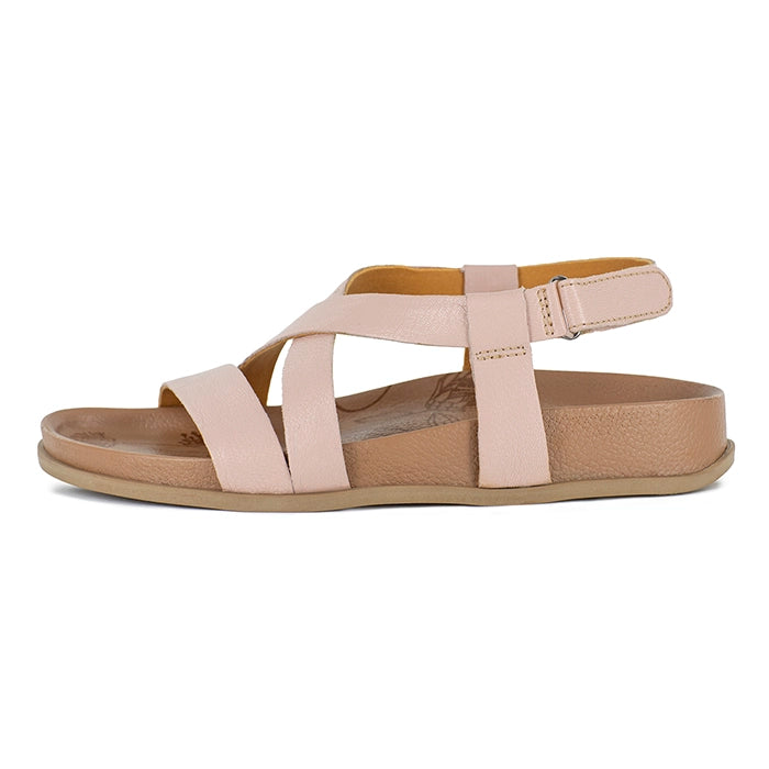Pink sandal with multiple straps on a white background