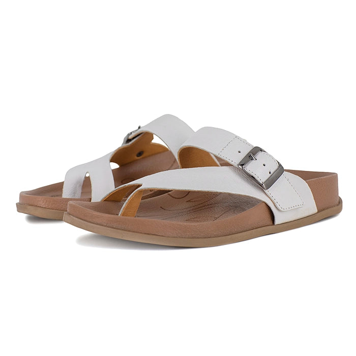 White sandals with brown soles on a white background