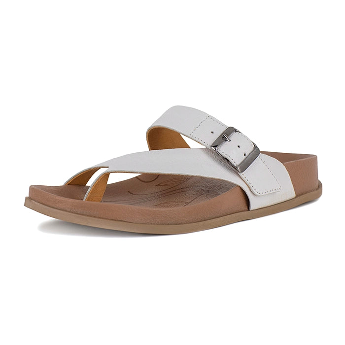 White sandal with brown sole on a white background
