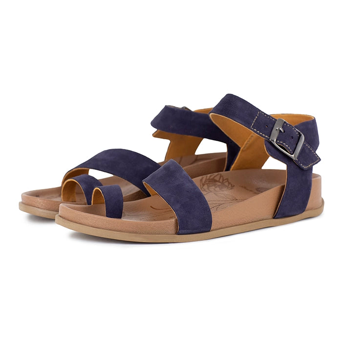 Navy sandals with brown soles on a white background