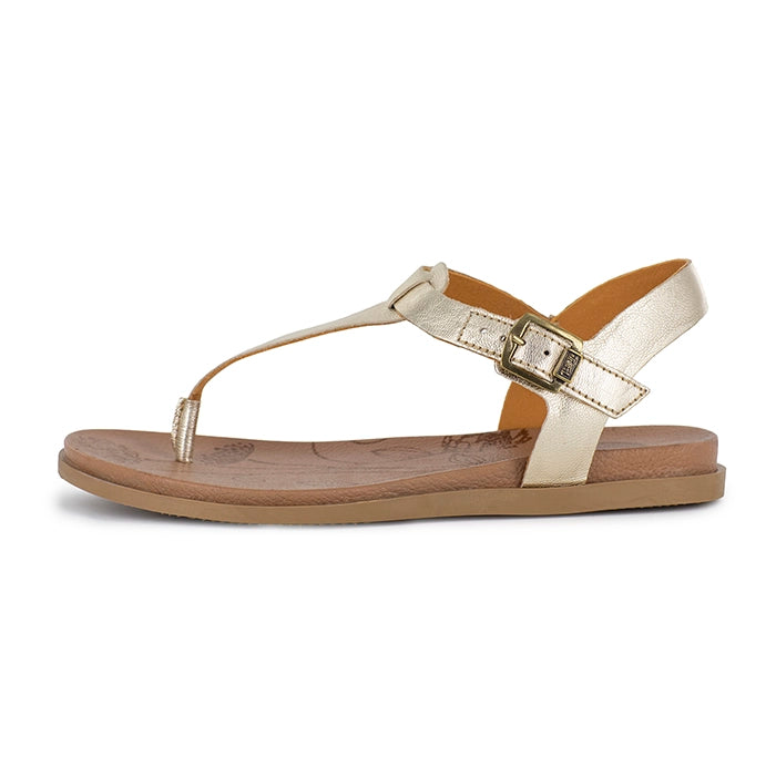 Gold sandal with a strap and buckle on a white background