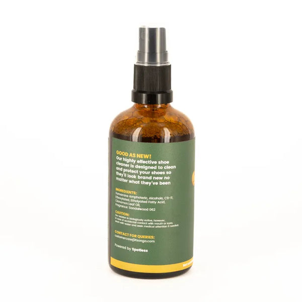 Brown spray bottle with green label on a white background