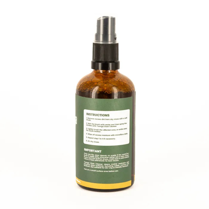 Brown spray bottle with green label on a white background
