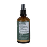 Brown spray bottle with a label on a white background
