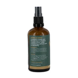 Brown spray bottle with a label on a white background