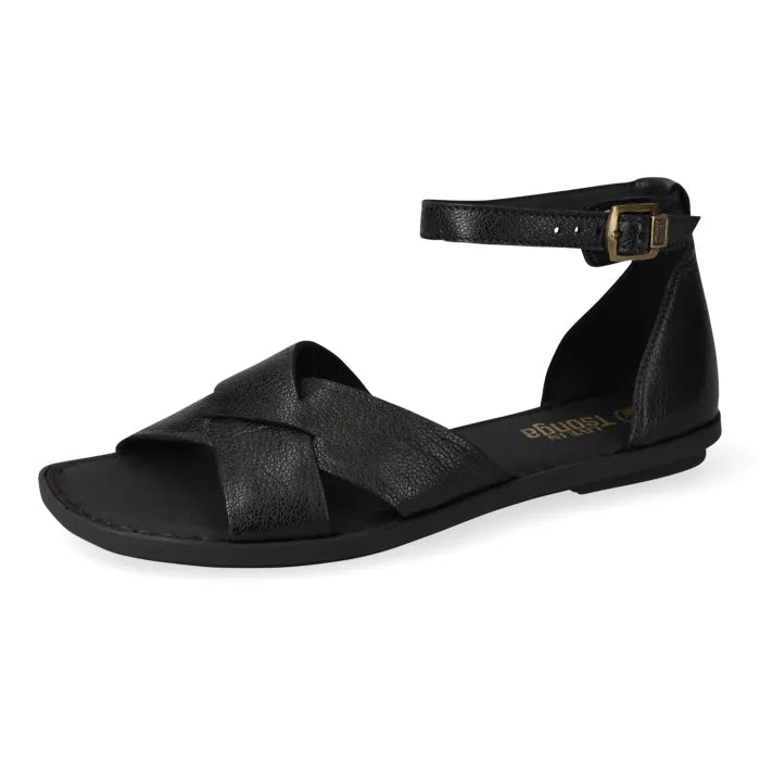 A black leather flat sandal with crisscrossing straps across the toes, a slim ankle strap with a gold-tone buckle, and a low-profile sole, shown from a side profile on a white background.