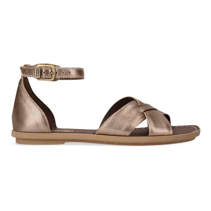 A metallic bronze leather flat sandal with an ankle strap and buckle, shown in a side profile on a white background.