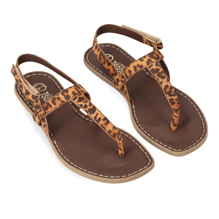 A pair of spotted print sandals with a T-bar strap.