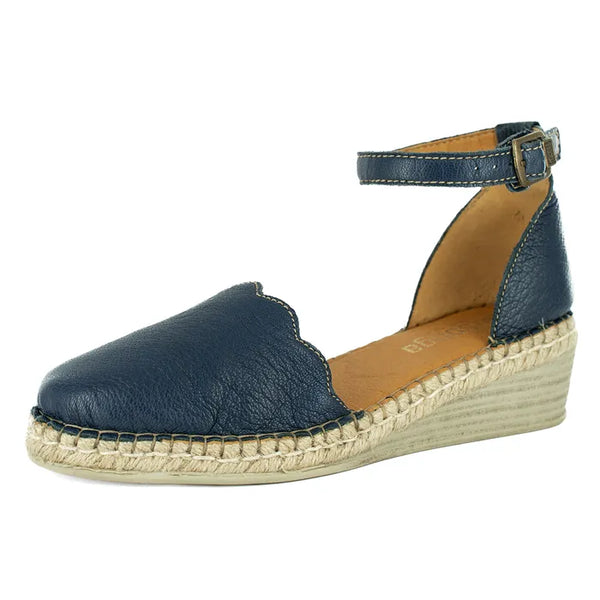 Navy blue wedge sandal with jute sole on a white background