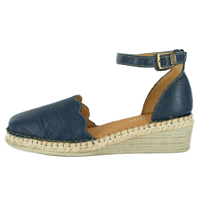 Blue espadrille sandal with a woven sole on a white background