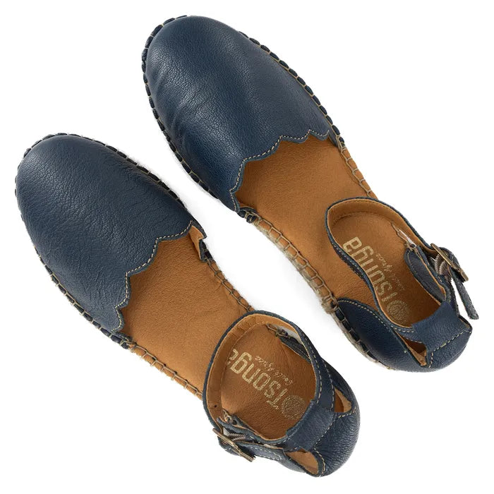 Pair of navy blue sandals with brown soles on a white background