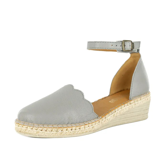 Grey wedge sandal with a braided sole on a white background