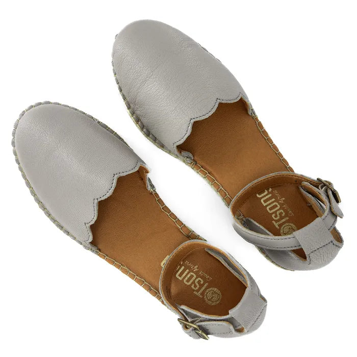 Pair of light grey espadrilles with brown soles on a white background